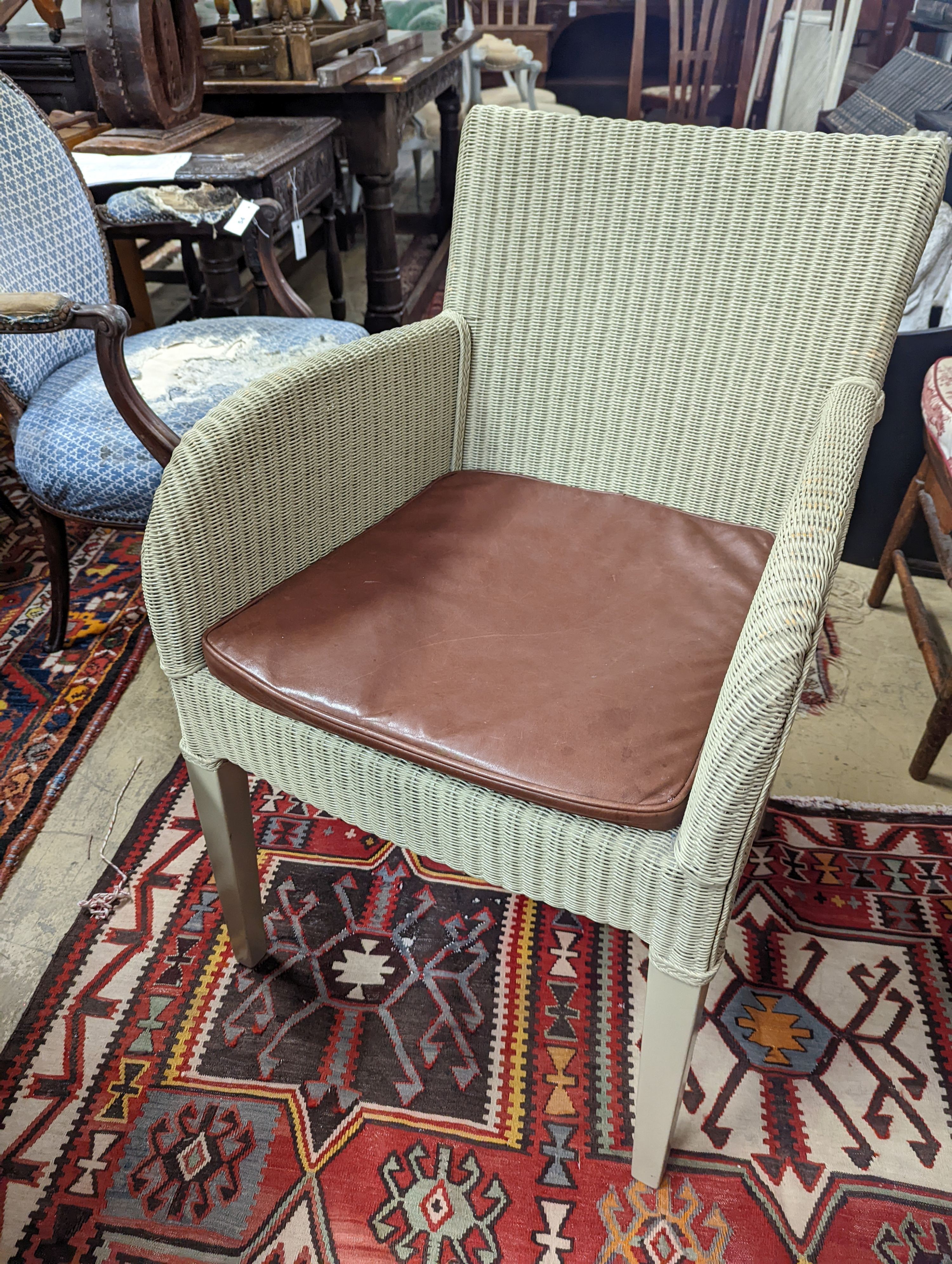 Vincent Sheppard, a set of four conservatory chairs with tan leather seats